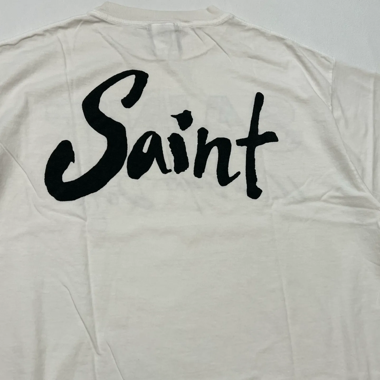 SAINT Mxxxxxx SS TEE/SUPER DIRTY/WHT oil painting SAINT SUPER DIRTY slogan TEE off-white S-XL Made of original OE yarn tube weaving without side seams to distinguish the split fabrics original consistent VINTAGE label/little angel anti-counterfeiting label top printing technology highly restored original details